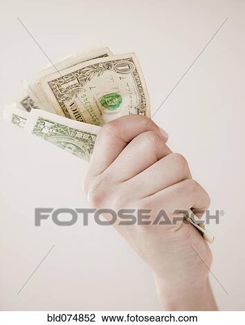 Woman gripping dollar bills View Large Photo Image Stock Image - Woman gripping dollar bills. Fotosearch