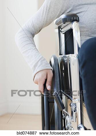 Stock Photo - Woman in wheelchair. Fotosearch