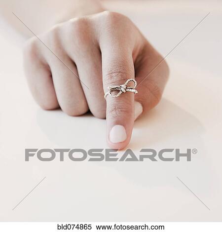 Woman with string tied around forefinger View Large Photo Image Stock Photography - Woman with string tied around forefinger. Fotosearch