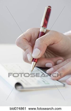 Woman writing personal check View Large Photo Image Stock Image - Woman writing personal check. Fotosearch