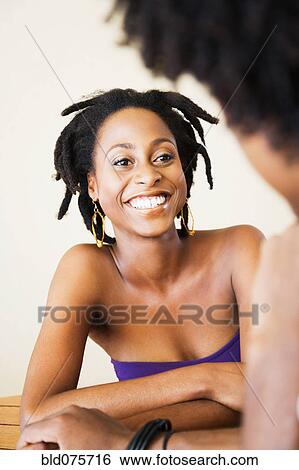Stock Photograph - African couple holding hands. Fotosearch
