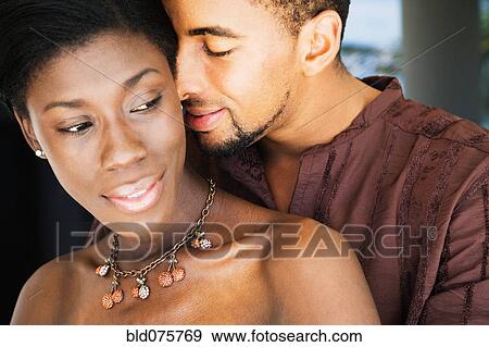 Stock Photo - African couple hugging. Fotosearch