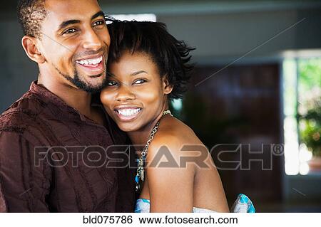 African couple hugging View Large Photo Image Stock Photograph - African couple hugging. Fotosearch