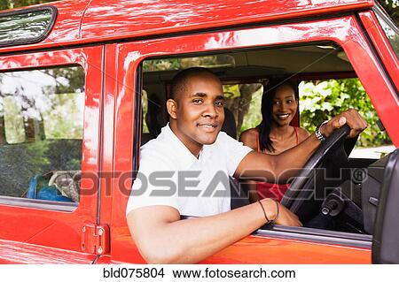 Picture - African couple in car. Fotosearch