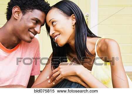 African couple smiling face to face View Large Photo Image Stock Photography - African couple smiling face to face. Fotosearch