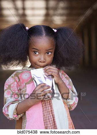 African girl drinking juice View Large Photo Image Stock Photo - African girl drinking juice. Fotosearch
