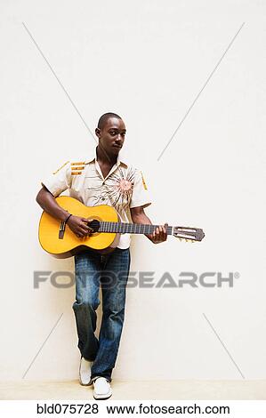 African man playing guitar View Large Photo Image Stock Photo - African man playing guitar. Fotosearch