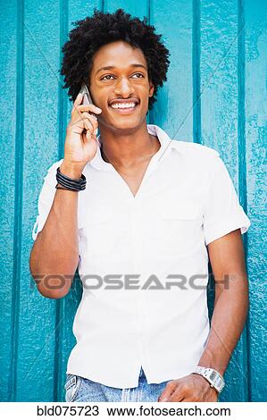 African man talking on cell phone View Large Photo Image Stock Image - African man talking on cell phone. Fotosearch