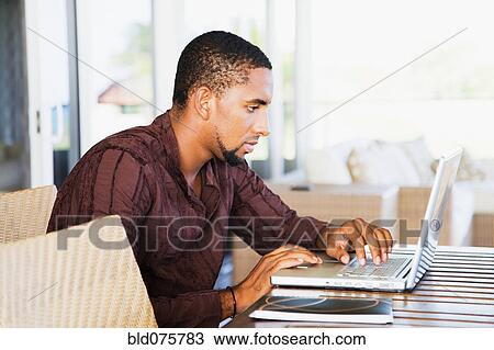 African man using laptop View Large Photo Image Stock Image - African man using laptop. Fotosearch
