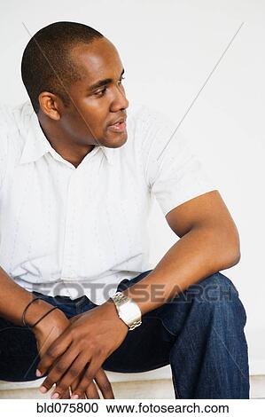 Stock Image - African man with head turned. Fotosearch