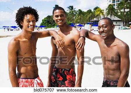 African men smiling on beach View Large Photo Image Stock Photo - African men smiling on beach. Fotosearch