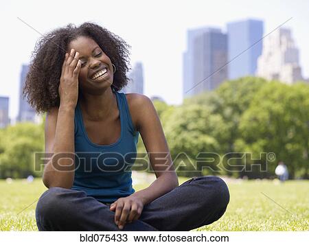 African woman laughing in park View Large Photo Image Stock Image - African woman laughing in park. Fotosearch