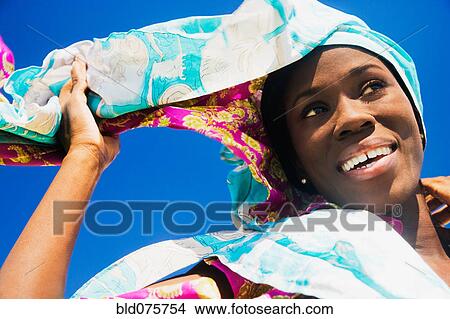 Picture - African woman wearing headscarf. Fotosearch