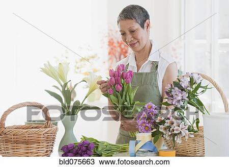 Stock Image - Chinese florist arranging flowers. Fotosearch