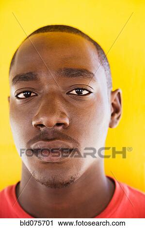 Close up of serious African man View Large Photo Image Stock Image - Close up of serious African man. Fotosearch