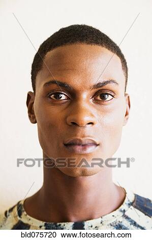 Close up of serious African man View Large Photo Image Stock Image - Close up of serious African man. Fotosearch