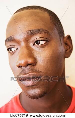 Close up of serious African man View Large Photo Image Stock Photo - Close up of serious African man. Fotosearch