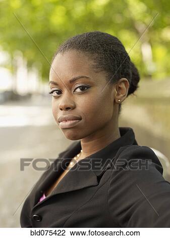 Stock Image - Close up of serious African businesswoman. Fotosearch