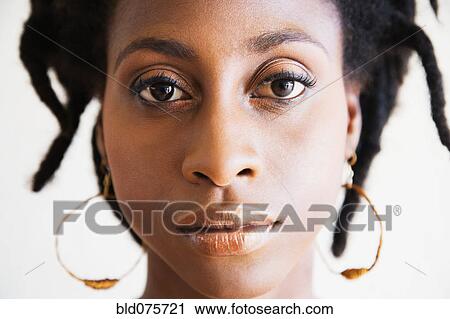 Close up of serious African woman View Large Photo Image Stock Image - Close up of serious African woman. Fotosearch
