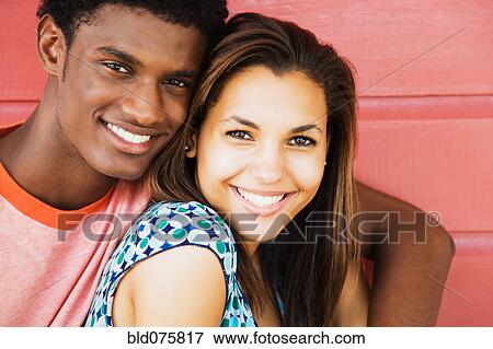 Stock Photo - Couple hugging and smiling. Fotosearch