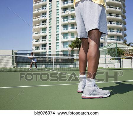 Picture - Couple playing tennis. Fotosearch
