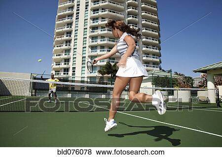 Couple playing tennis View Large Photo Image Stock Photo - Couple playing tennis. Fotosearch