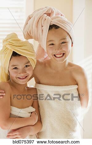 Stock Photo - Girls wrapped in towels. Fotosearch
