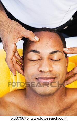 Mixed race man receiving head massage View Large Photo Image Stock Image - Mixed race man receiving head massage. Fotosearch