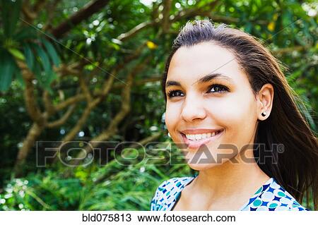 Stock Image - Mixed race woman smiling. Fotosearch