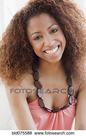 Mixed race woman smiling View Large Photo Image Stock Photo - Mixed race woman smiling. Fotosearch