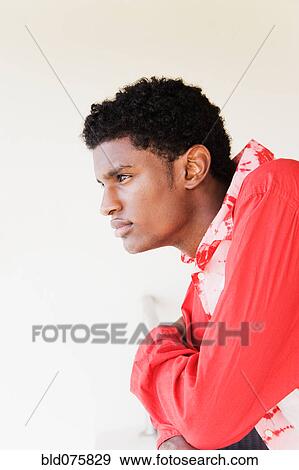 Pensive African man leaning on railing View Large Photo Image Stock Photo - Pensive African man leaning on railing. Fotosearch