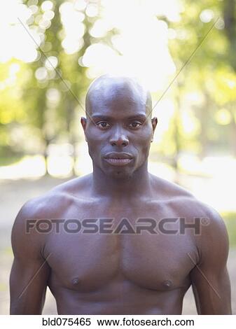 Serious African man with bare chest View Large Photo Image Stock Photography - Serious African man with bare chest. Fotosearch