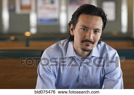 Serious mixed race man View Large Photo Image Stock Photograph - Serious mixed race man. Fotosearch