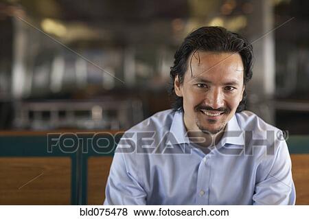 Stock Photo - Smiling mixed race man. Fotosearch