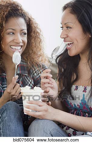 Picture - Women eating ice cream. Fotosearch