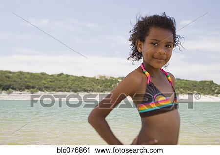 African girl wearing bikini on beach View Large Photo Image Stock Image - African girl wearing bikini on beach. Fotosearch