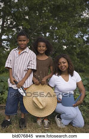 African mother and children in garden View Large Photo Image Stock Photography - African mother and children in garden. Fotosearch