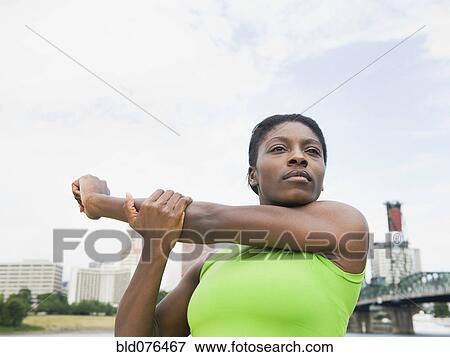 African woman stretching View Large Photo Image Stock Photo - African woman stretching. Fotosearch