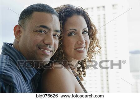 Stock Photograph - Couple hugging and smiling. Fotosearch