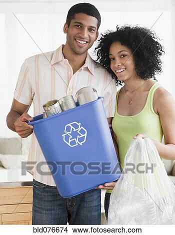 Couple recycling View Large Photo Image Picture - Couple recycling. Fotosearch