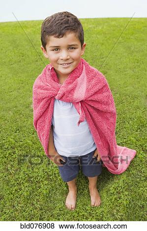 Stock Photo - Hispanic boy wearing towel cape. Fotosearch