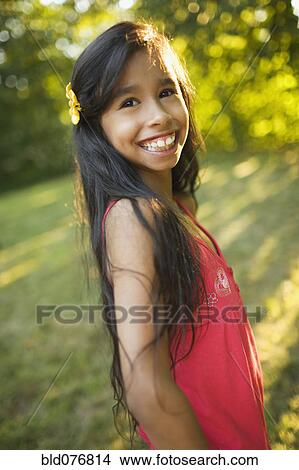 Picture - Hispanic girl smiling. Fotosearch