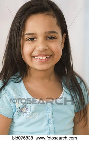 Stock Photo - Hispanic girl smiling. Fotosearch