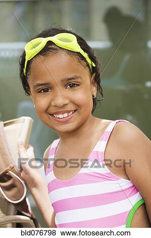 Hispanic girl wearing bathing suit View Large Photo Image Stock Photo - Hispanic girl wearing bathing suit. Fotosearch