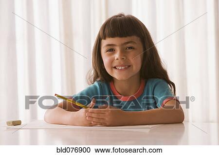 Hispanic girl with paper and pencil View Large Photo Image Stock Image - Hispanic girl with paper and pencil. Fotosearch