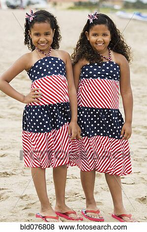 Hispanic girls in sundresses on beach View Large Photo Image Stock Photo - Hispanic girls in sundresses on beach. Fotosearch