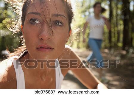 Stock Photo - Hispanic woman on nature trail. Fotosearch