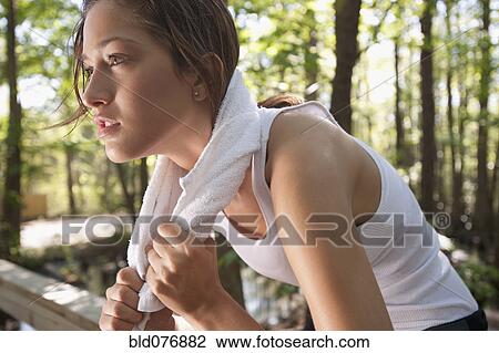 Hispanic woman with towel around neck View Large Photo Image Stock Image - Hispanic woman with towel around neck. Fotosearch