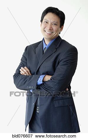 Stock Photo - Japanese businessman with arms crossed. Fotosearch