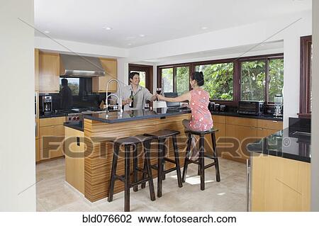 Japanese couple drinking wine in kitchen View Large Photo Image Stock Image - Japanese couple drinking wine in kitchen. Fotosearch